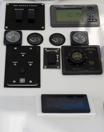  Yacht Photos Pics Control panel of a 1999 Ocean Yachts 60 Convertible, featuring gauges and navigation instruments.