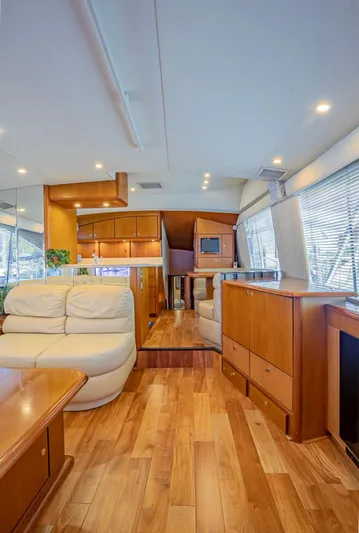  Yacht Photos Pics Luxurious interior of 1999 Ocean Yachts 60 Convertible with wooden flooring and modern furnishings.