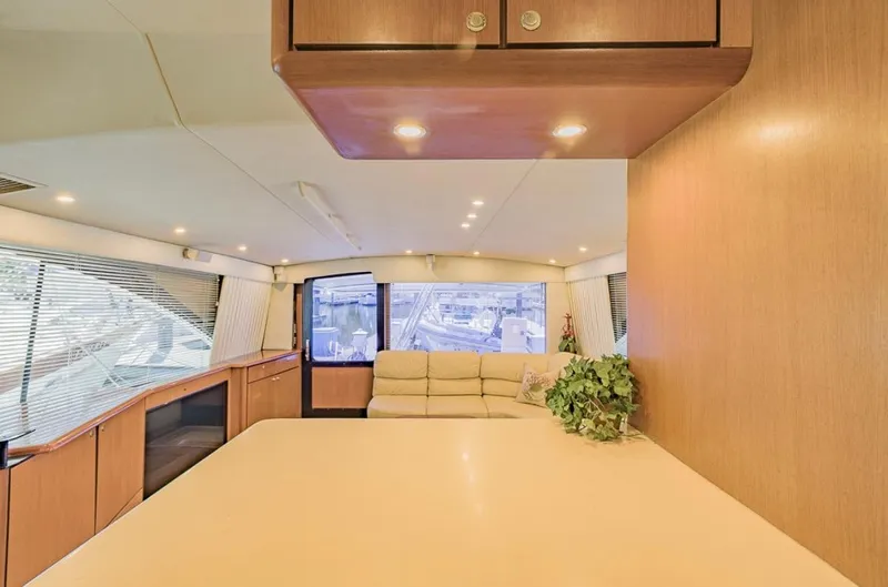  Yacht Photos Pics Luxurious interior of 1999 Ocean Yachts 60 Convertible with modern furnishings and ample natural light.