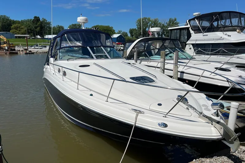 Yacht Photos Pics 2005 Sea Ray 340 Sundancer docked at marina under clear blue sky.