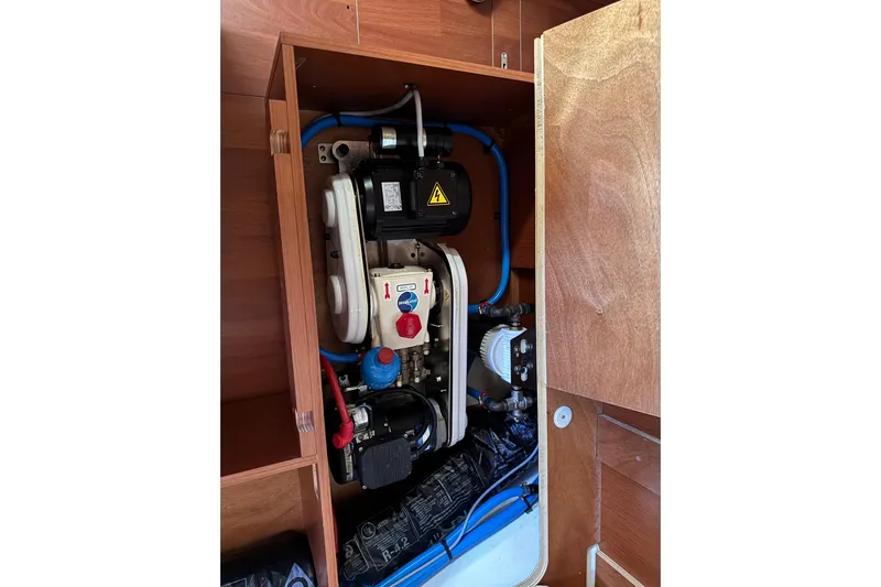 Take 2 Yacht Photos Pics Engine compartment of a 2019 Beneteau Oceanis 41.1 sailboat, showcasing mechanical components.