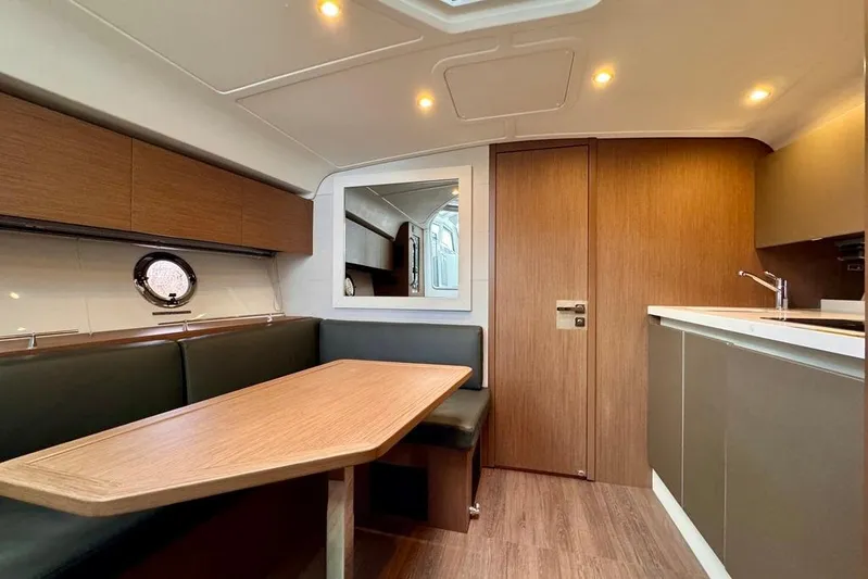  Yacht Photos Pics Luxurious interior of 2021 Beneteau Gran Turismo 40 yacht with modern dining area.