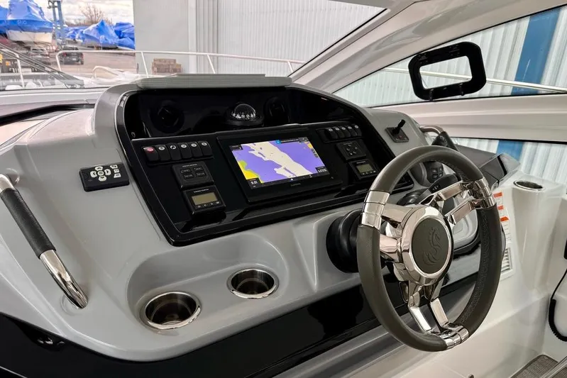  Yacht Photos Pics 2021 Beneteau Gran Turismo 40 helm with navigation display and modern steering wheel.