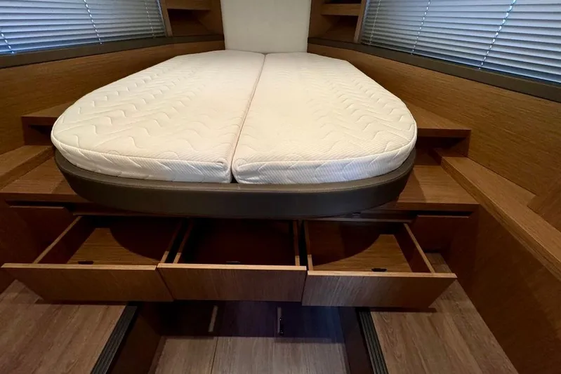  Yacht Photos Pics Interior cabin of 2021 Beneteau Gran Turismo 40 with bed and storage drawers.