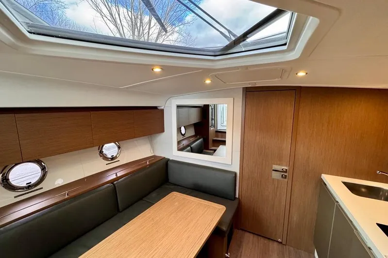  Yacht Photos Pics Interior of 2021 Beneteau Gran Turismo 40 yacht with skylight and modern furnishings.