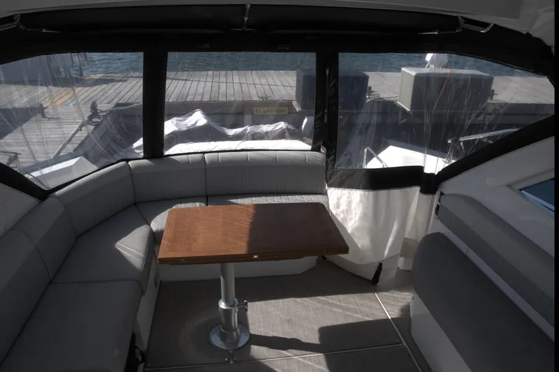  Yacht Photos Pics Interior of 2021 Beneteau Gran Turismo 40 yacht with seating and table.