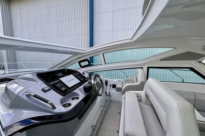  Yacht Photos Pics 2021 Beneteau Gran Turismo 40 cockpit with modern navigation system and sleek design.