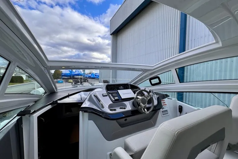  Yacht Photos Pics 2021 Beneteau Gran Turismo 40 cockpit with modern steering and navigation system.