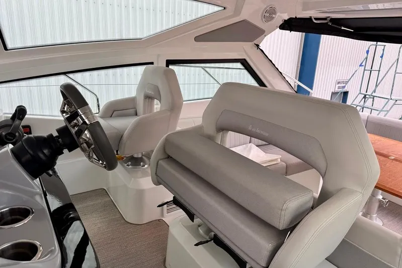  Yacht Photos Pics Interior of 2021 Beneteau Gran Turismo 40 yacht, featuring modern helm and seating.