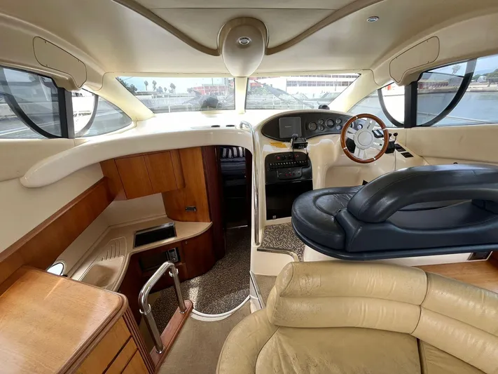  Yacht Photos Pics 2005 Azimut 43 yacht interior with leather seating and wooden accents.