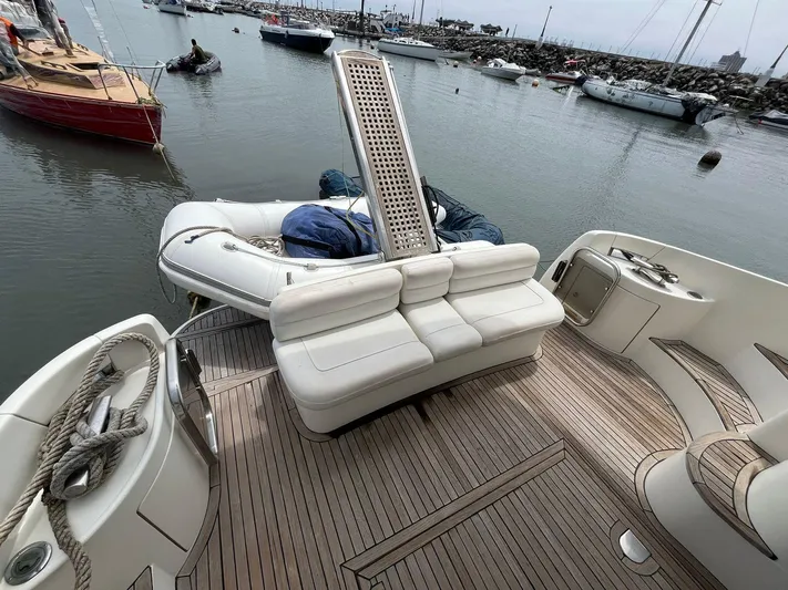  Yacht Photos Pics 2005 Azimut 43 yacht with spacious deck and seating, docked in a marina.