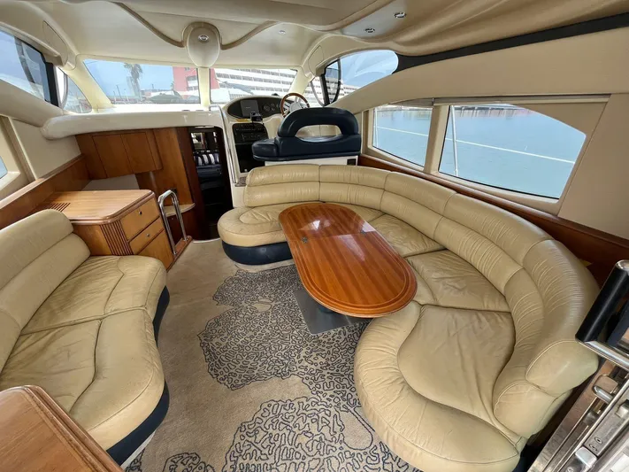  Yacht Photos Pics Luxurious interior of a 2005 Azimut 43 yacht with leather seating and wooden table.