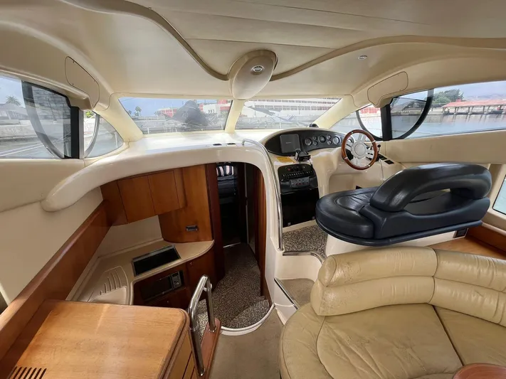  Yacht Photos Pics Interior of 2005 Azimut 43 yacht with luxurious seating and modern helm.