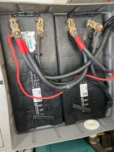  Yacht Photos Pics Battery compartment of a 2005 Azimut 43 boat, showing connected cables and terminals.