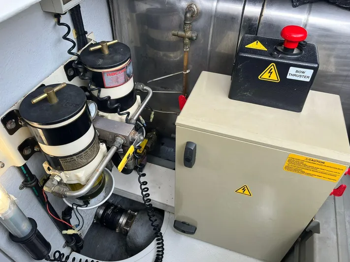  Yacht Photos Pics Engine room of 2005 Azimut 43 yacht with mechanical components and control panel.