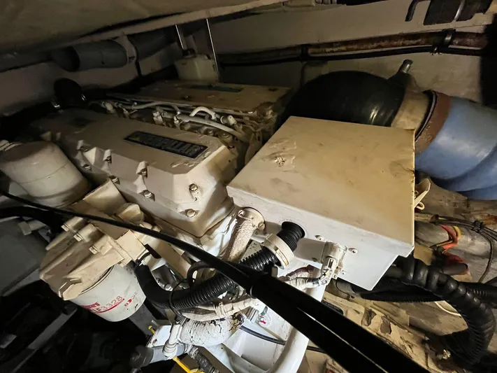  Yacht Photos Pics Engine compartment of a 2005 Azimut 43 yacht, showcasing mechanical components and wiring.