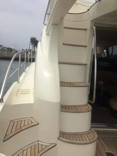  Yacht Photos Pics Azimut 43 yacht, 2005 model, featuring elegant teak steps and sleek design.