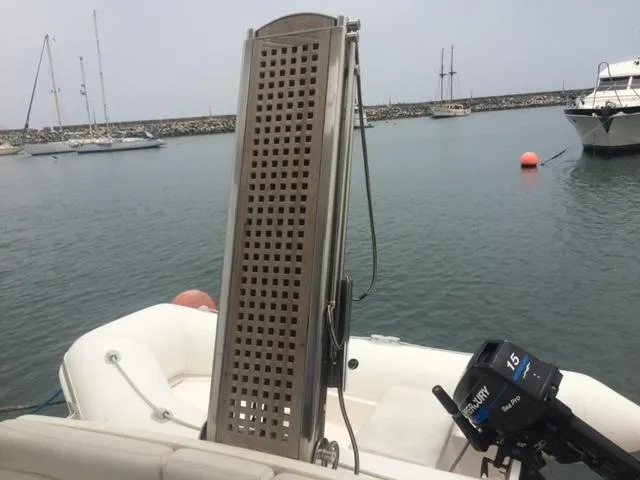  Yacht Photos Pics 2005 Azimut 43 yacht with outboard motor in a marina setting.