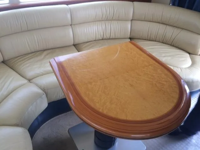  Yacht Photos Pics Luxurious Azimut 43 yacht interior with elegant leather seating and polished wooden table, 2005 model.