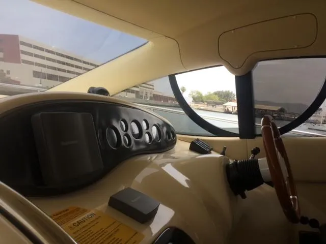  Yacht Photos Pics Interior view of 2005 Azimut 43 yacht cockpit with steering wheel and control panel.