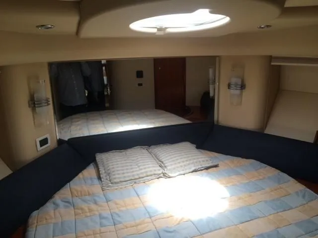  Yacht Photos Pics Luxurious cabin interior of 2005 Azimut 43 yacht with cozy bedding.