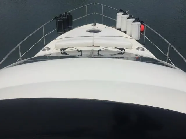  Yacht Photos Pics Bow view of 2005 Azimut 43 yacht on calm water.