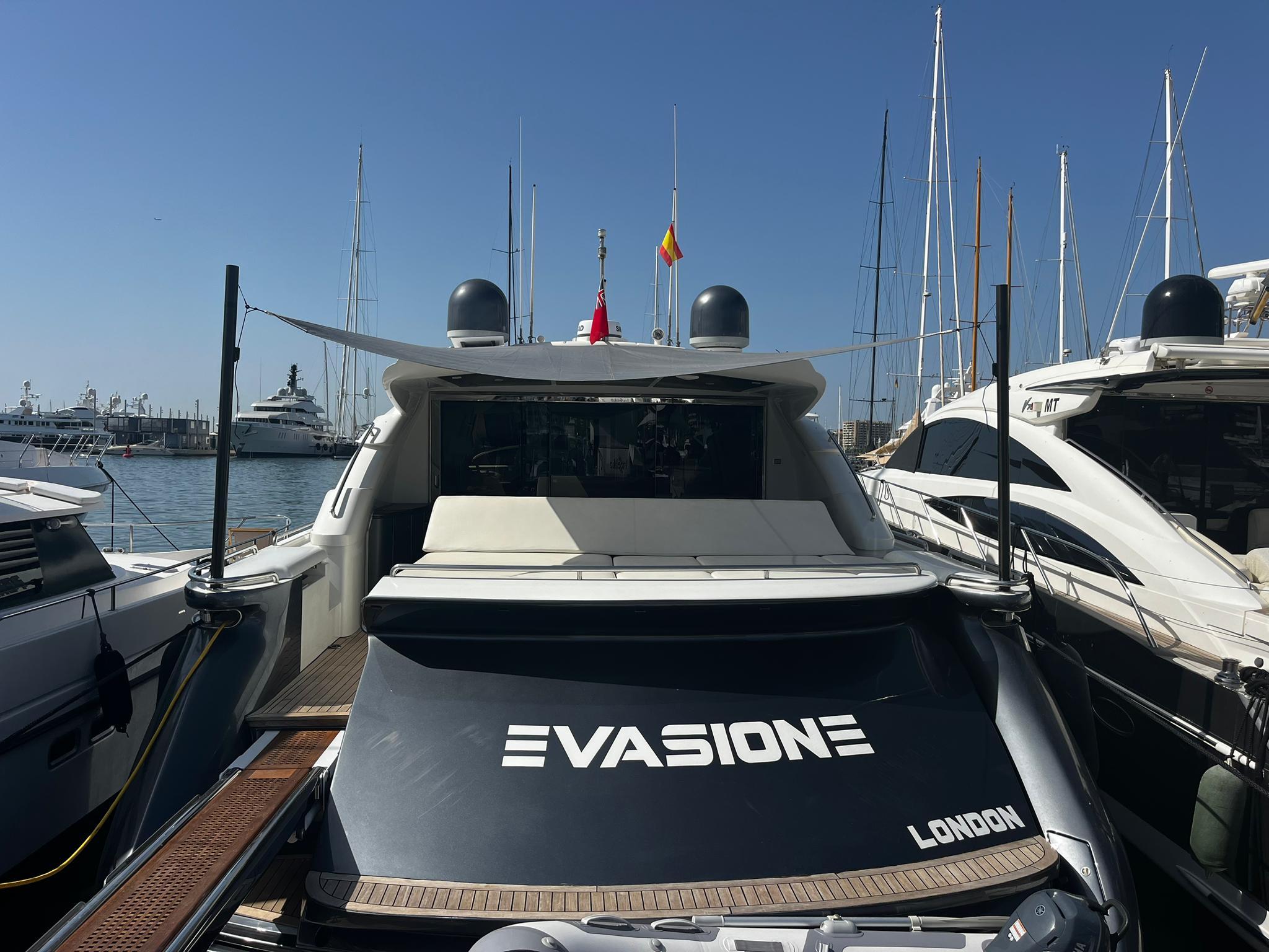 2004 Pershing 76 yacht docked in marina, rear view with "Evasione" branding.