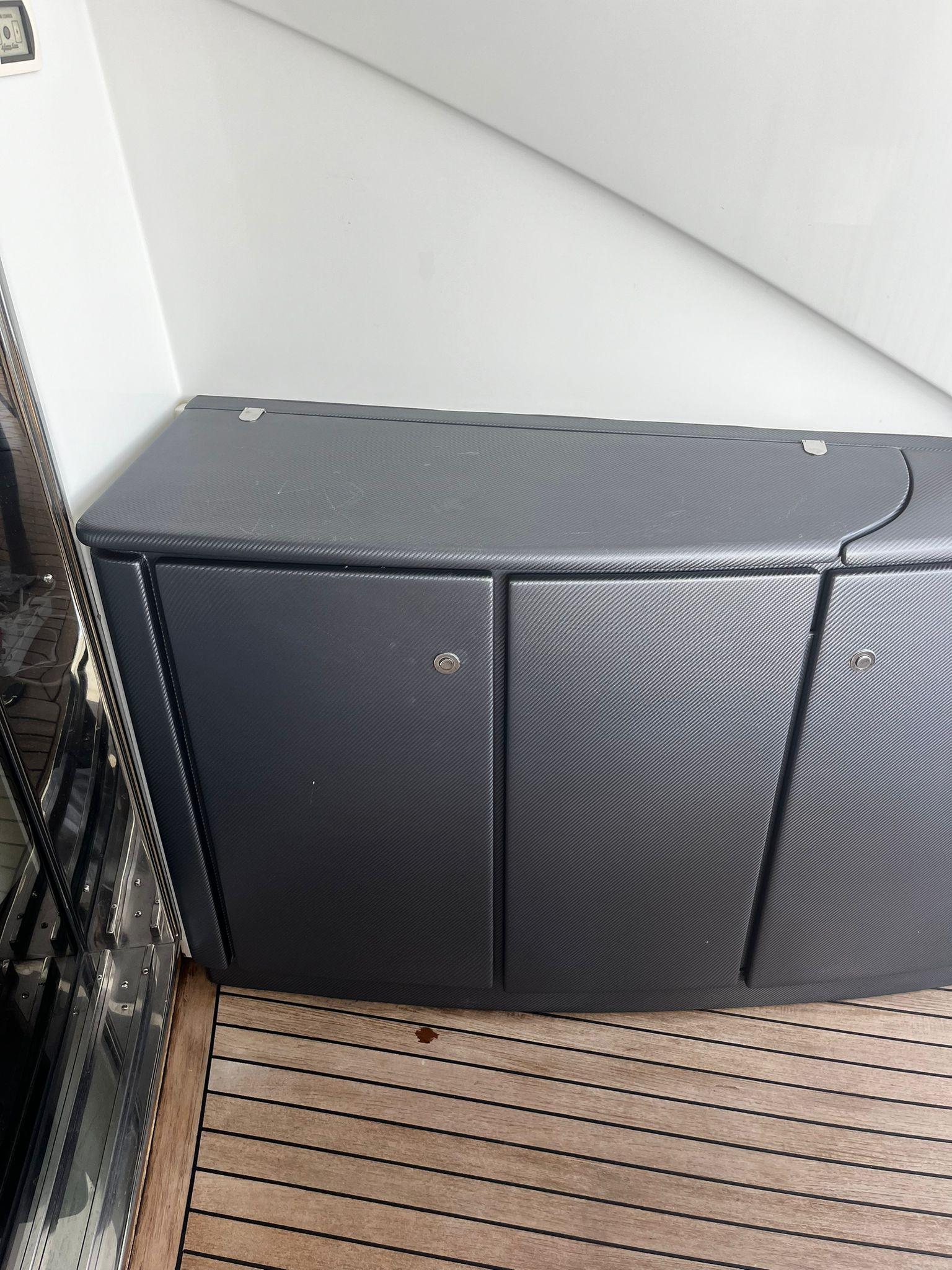 2004 Pershing 76 yacht interior with sleek cabinetry and wooden flooring.