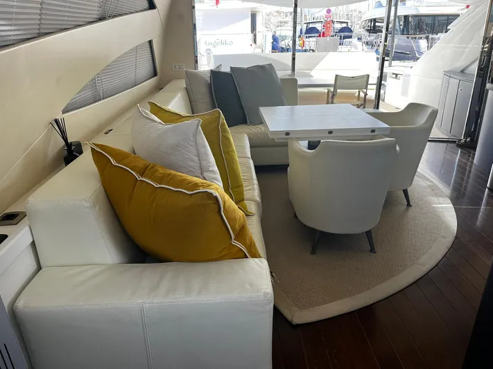  Yacht Photos Pics Luxurious interior of a 2004 Pershing 76 yacht with elegant seating and dining area.