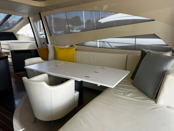  Yacht Photos Pics Luxurious interior of a 2004 Pershing 76 yacht with modern seating and table.
