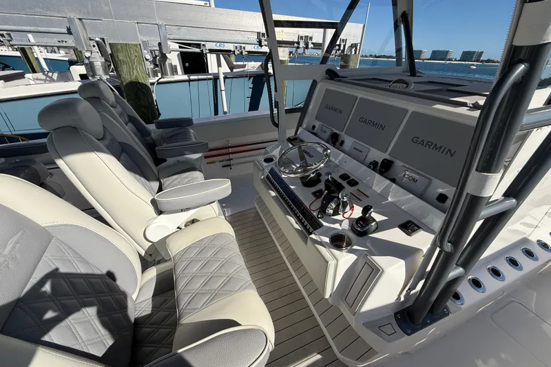 Yacht Photos Pics Luxurious helm of 2022 Invincible 40 Catamaran with advanced Garmin navigation systems.