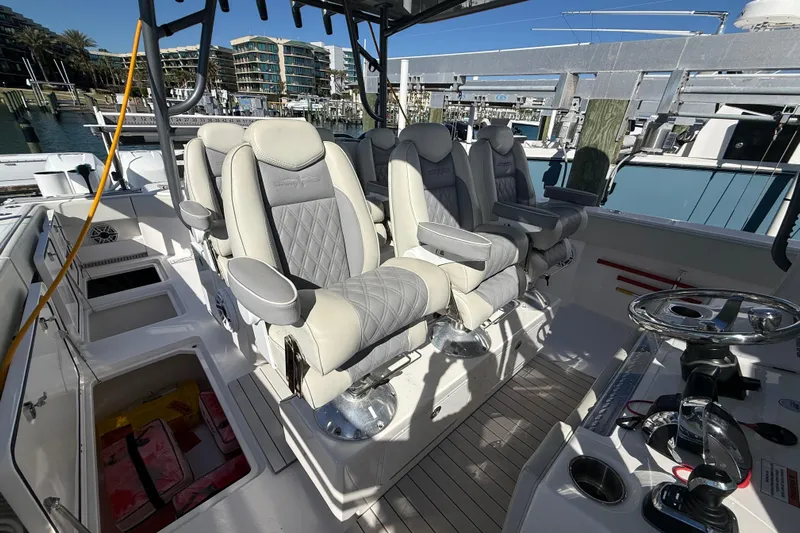  Yacht Photos Pics Luxurious seating on 2022 Invincible 40 Catamaran, docked at marina.