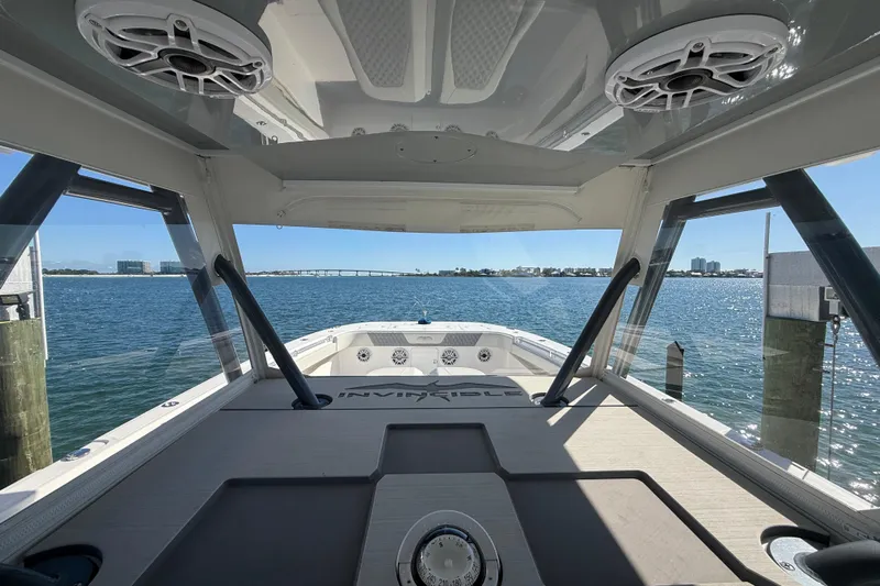  Yacht Photos Pics Invincible 40 Catamaran 2022 interior view with ocean backdrop and modern design.