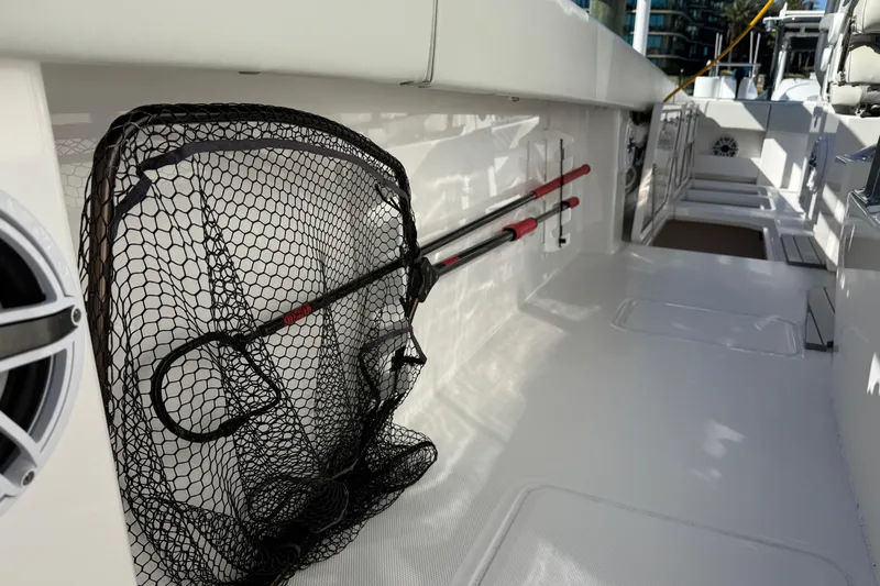 Yacht Photos Pics 2022 Invincible 40 Catamaran deck with fishing net and rods stored neatly.