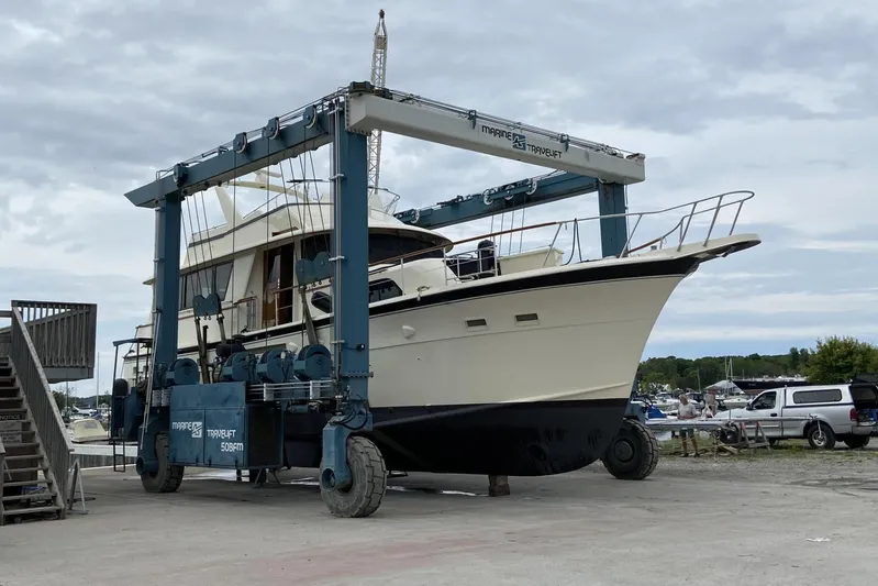  Yacht Photos Pics 1985 Hatteras 53 Extended Deckhouse Motor Yacht on a marine travel lift.