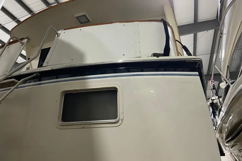  Yacht Photos Pics 1985 Hatteras 53 Extended Deckhouse Motor Yacht in storage, rear view.