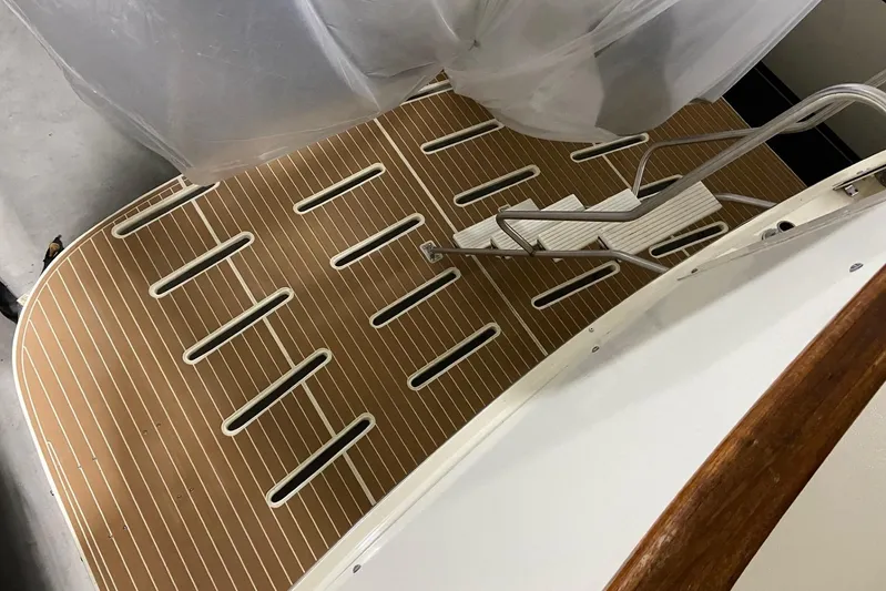  Yacht Photos Pics 1985 Hatteras 53 Extended Deckhouse Motor Yacht swim platform with ladder and teak decking.