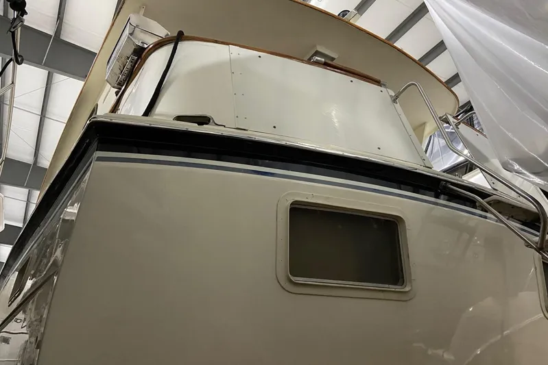  Yacht Photos Pics 1985 Hatteras 53 Extended Deckhouse Motor Yacht in storage, rear view.