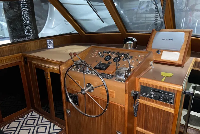  Yacht Photos Pics 1985 Hatteras 53 Motor Yacht helm with Garmin navigation and classic wooden design.
