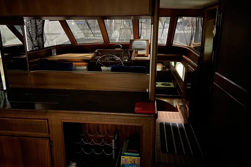  Yacht Photos Pics Interior of 1985 Hatteras 53 Extended Deckhouse Motor Yacht, featuring wood paneling and helm station.