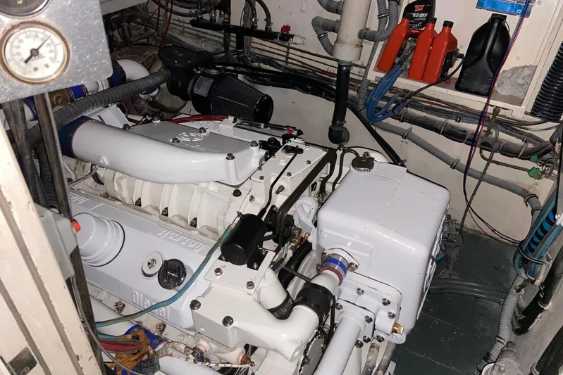  Yacht Photos Pics Engine room of 1985 Hatteras 53 Extended Deckhouse Motor Yacht, showcasing machinery and components.