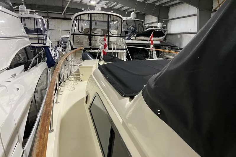  Yacht Photos Pics 1985 Hatteras 53 Extended Deckhouse Motor Yacht in indoor storage, side view.