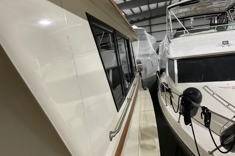  Yacht Photos Pics 1985 Hatteras 53 Extended Deckhouse Motor Yacht in storage, side view.