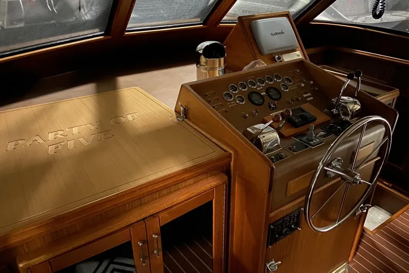  Yacht Photos Pics 1985 Hatteras 53 Motor Yacht helm with wooden dashboard and "Party of Five" engraving.