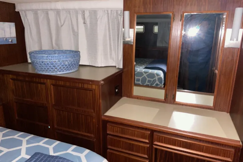  Yacht Photos Pics Interior of 1985 Hatteras 53 Motor Yacht with wood cabinetry and mirrors.