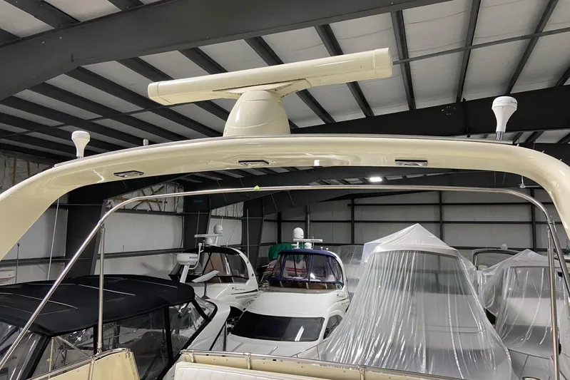  Yacht Photos Pics 1985 Hatteras 53 Extended Deckhouse Motor Yacht in storage, featuring radar equipment.