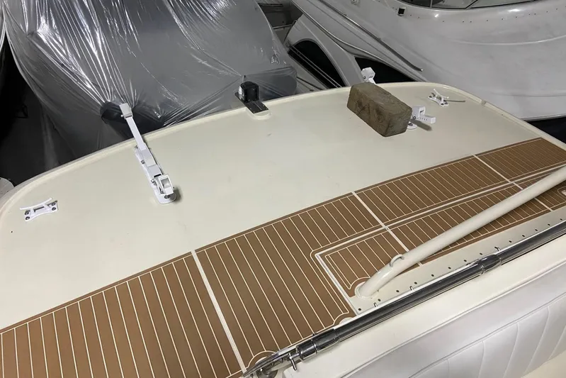  Yacht Photos Pics 1985 Hatteras 53 Extended Deckhouse Motor Yacht deck with fittings and a brick.