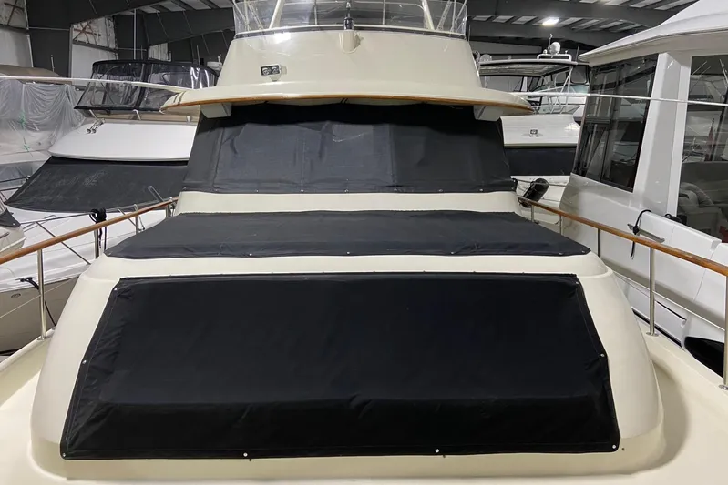  Yacht Photos Pics 1985 Hatteras 53 Extended Deckhouse Motor Yacht in indoor storage.