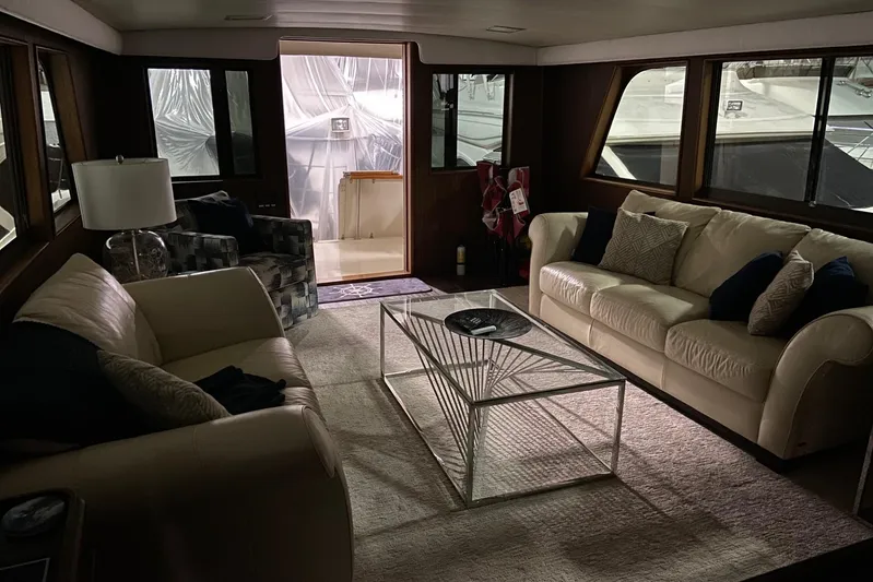  Yacht Photos Pics Interior of 1985 Hatteras 53 Motor Yacht with elegant sofas and modern decor.