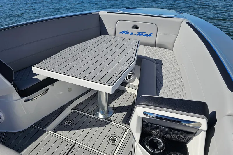  Yacht Photos Pics 2025 Nor-Tech 390 Sport Center Console boat interior with sleek seating and table design.